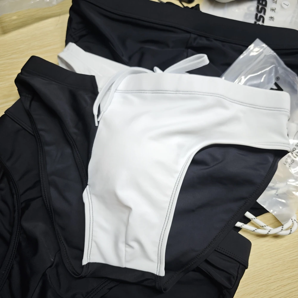 2026 men's black and white color matching triangle swimming trunks cup low waist hot spring beach swimming trunks 10122zb