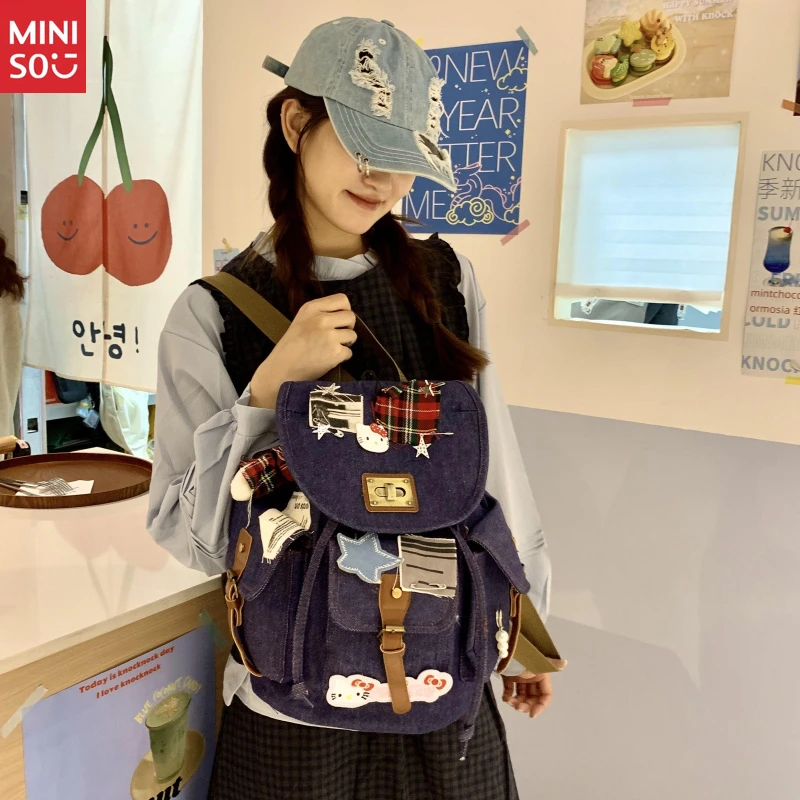 Miniso Nueva mochila Hello Kitty Bone, patchwork de mezclilla desgastado, mochila con bloques de color