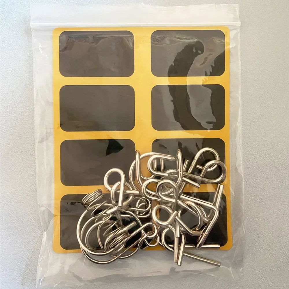 8 ชิ้น/เซ็ตโลหะมอนเตสซอรี่ปริศนาลวด IQ สมองพัฒนาสมองปริศนาเด็กผู้ใหญ่เกมแบบโต้ตอบผ่อนคลายของเล่นเพื่อการศึกษา