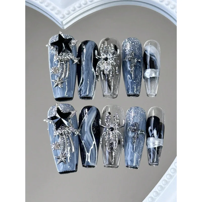 

Y2K 10 шт. Длинные накладные ногти в форме гроба с черным струящимся звездным дизайном, каждый комплект поставляется с 1 трубкой клея и 1 пилочкой для ногтей.