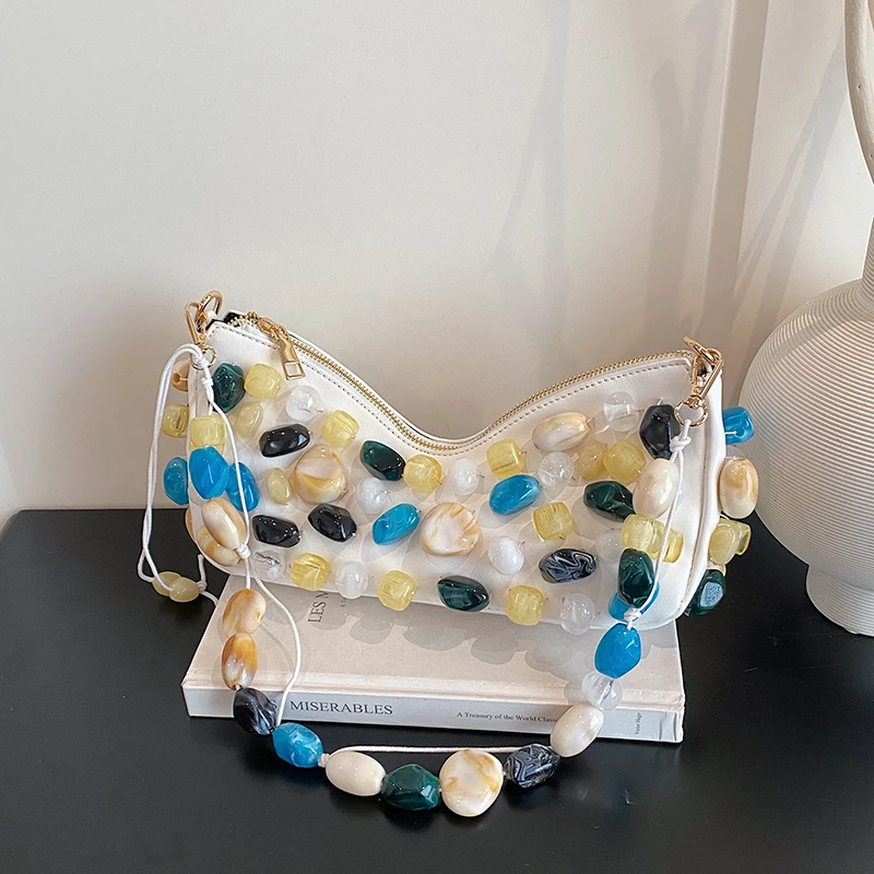 

Новая высококачественная сумка-багет 2026 года для тяжелой промышленности с ярким каменным декором, индивидуальным дизайном и трендовым стилем