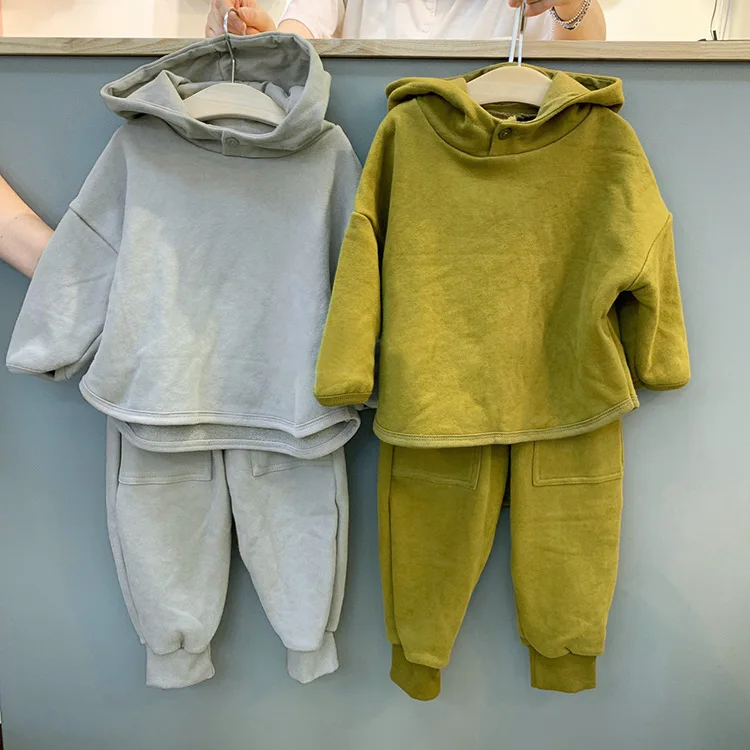 Abbigliamento per bambini coreano autunnale Nuovi ragazzi e ragazze Moda semplice pullover con cappuccio con bottoni