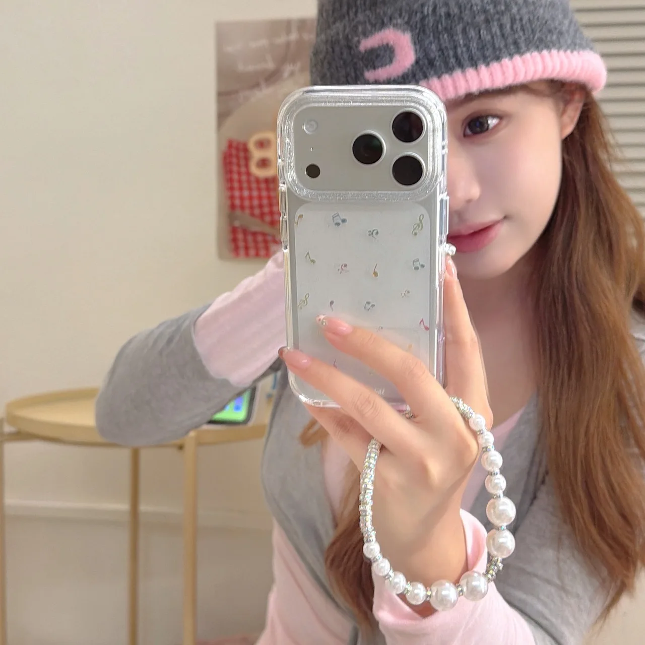 Funda de teléfono serie IMD de doble cara con airbag de borde redondo dorado con símbolo musical colorido de pantalla completa adecuada para iPhone ProMax17 16 15