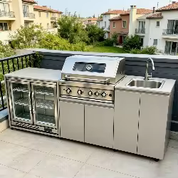Close-up view of stainless steel BBQ cooktop and control knobs