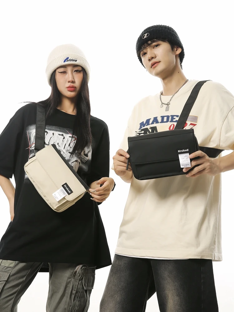 Original design messenger bag male contrast flip shoulder bag street casual small bag work mobile phone bag female.