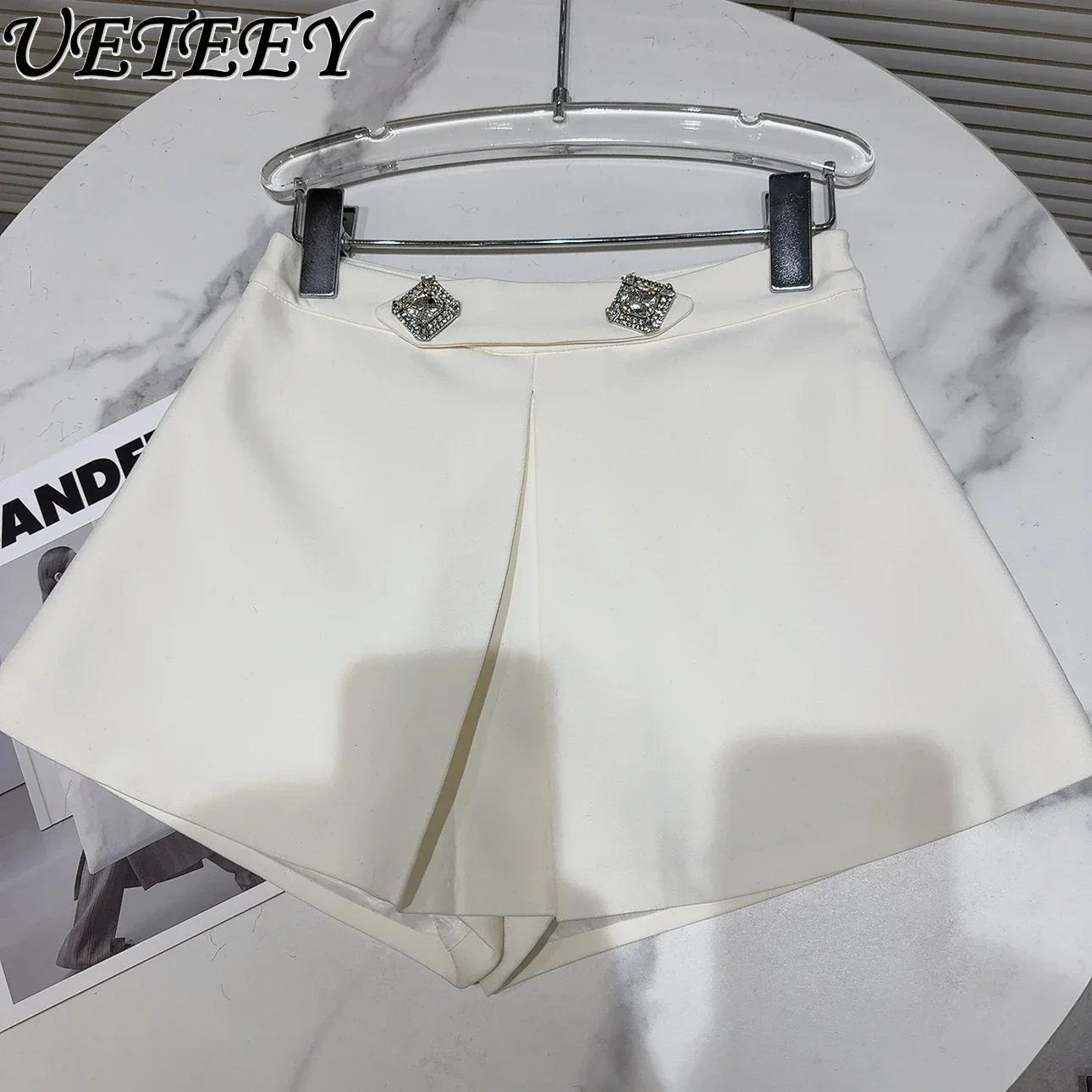 Minifalda con diamantes de imitación para mujer, pantalones cortos informales con dobladillo, diseño de temperamento social, Bootcut, otoño e