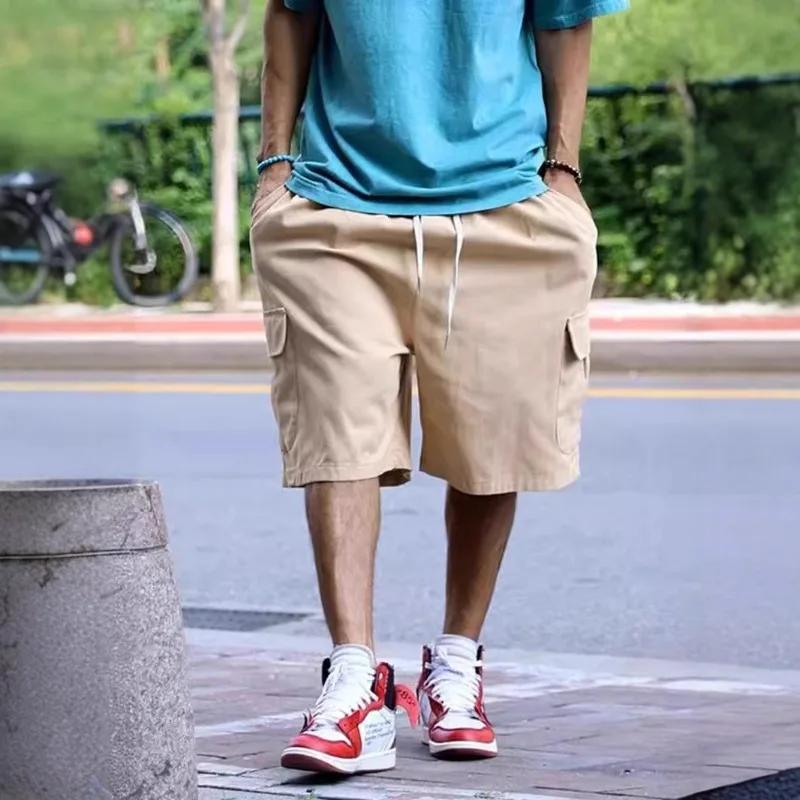 

New solid color tooling shorts multi-bag men's summer loose straight large size simple leisure sports