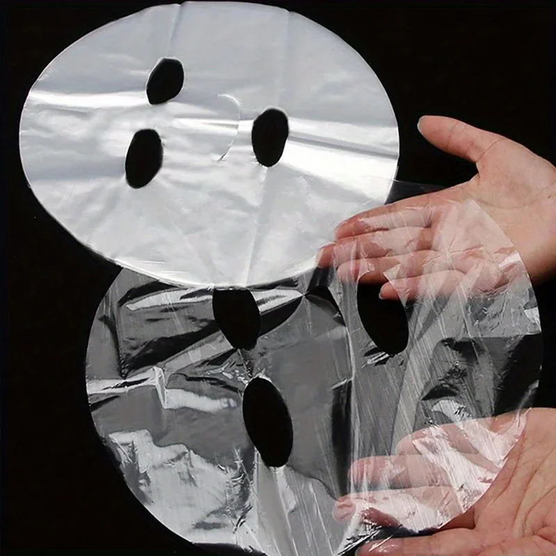 100 Stück transparente Einweg-PE-Maske mit Vollgesichtsbedeckung, universelle Hautpflegemaske für die Schönheitspflege, feuchtigkeitsspendendes Zubehör