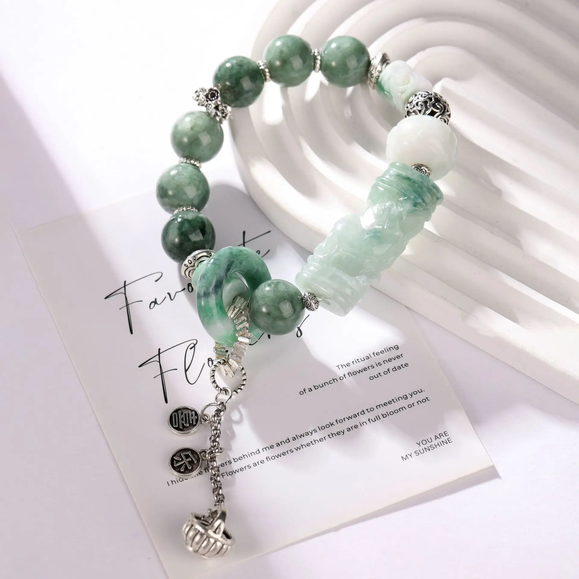 

Bracelet jadeite carved cylindrical flower beads, vivid green jadeite running rings