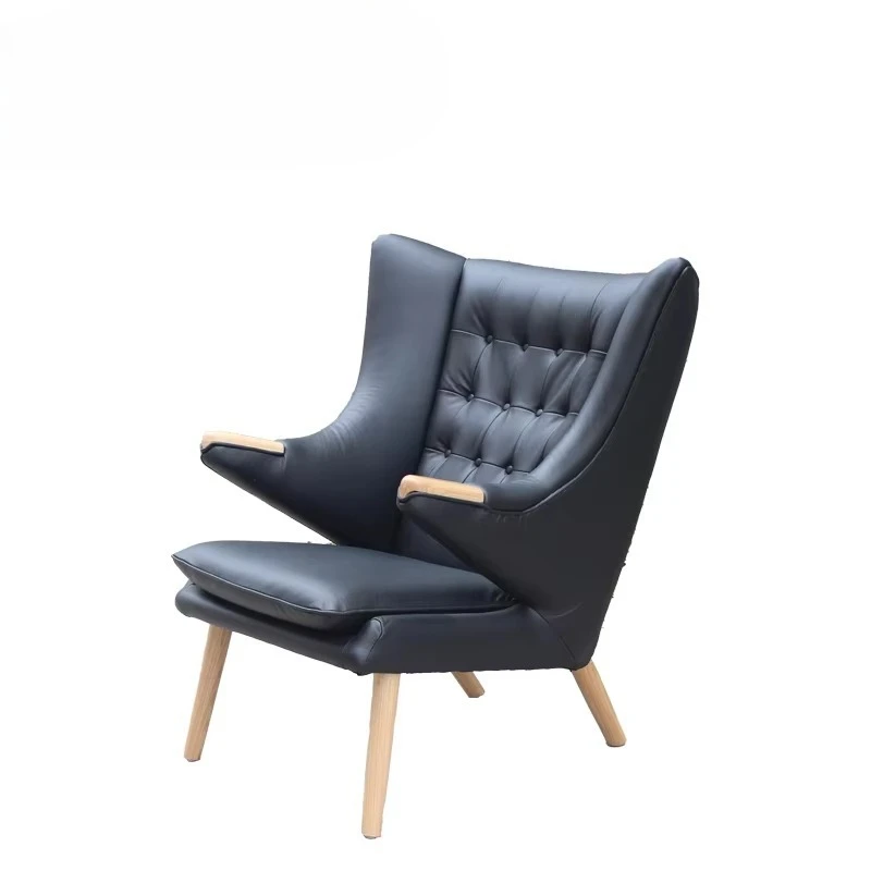 Decorative chair with solid wood legs, artificial leather interior, tufted buttons, and design chair