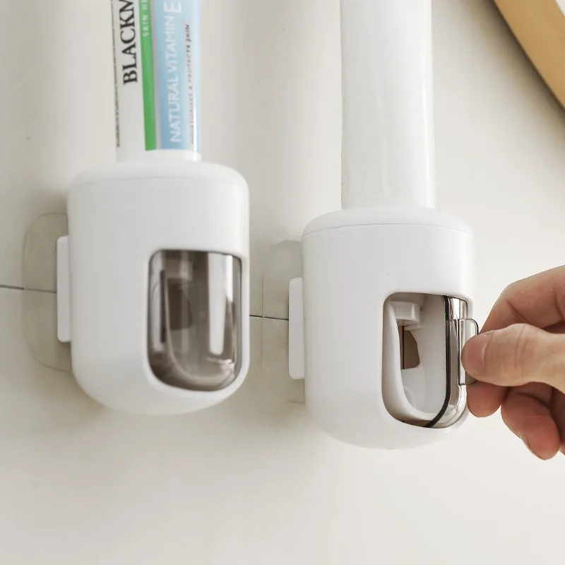 

The wall-mounted dust-proof and hygienic automatic toothpaste dispenser with a lid is easy to use. It can squeeze toothpaste in