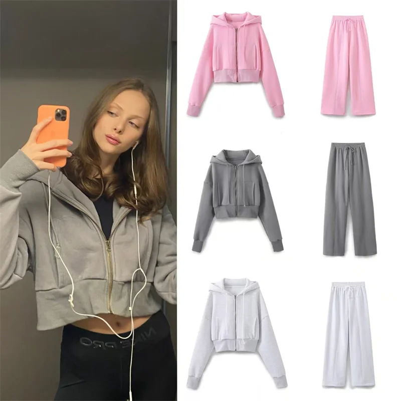 

Женский костюм, зима 2025, новый стиль, однотонная короткая куртка с длинными рукавами и капюшоном, свободные длинные брюки, спортивный модный комплект