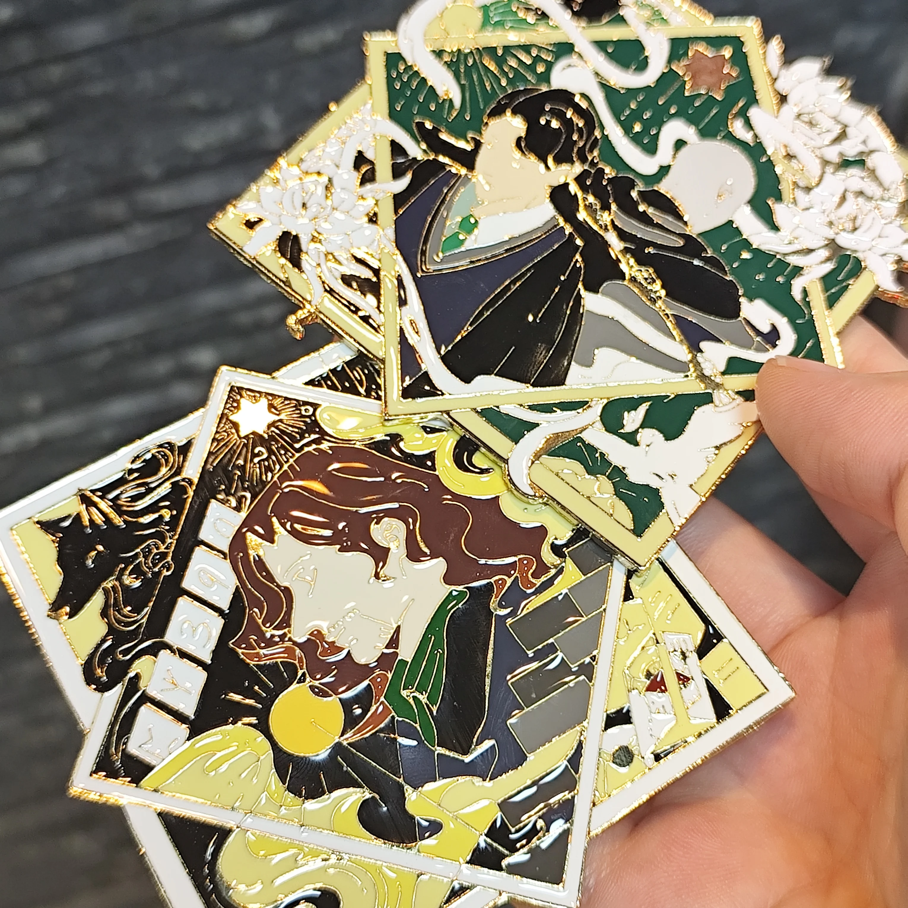 Three square enamel pins: intricate designs, colorful detailed frames. Great for adding artistry to bags, jackets.