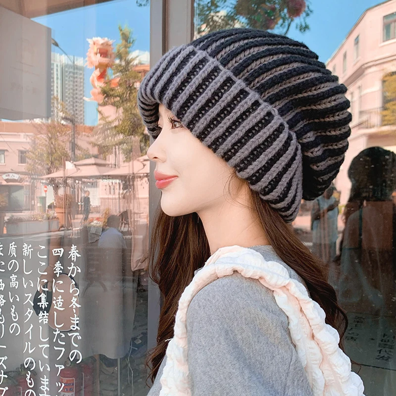 Ladies' autumn and winter big head circumference pile cap Korean version fashionable color blocked striped warm knitted hat