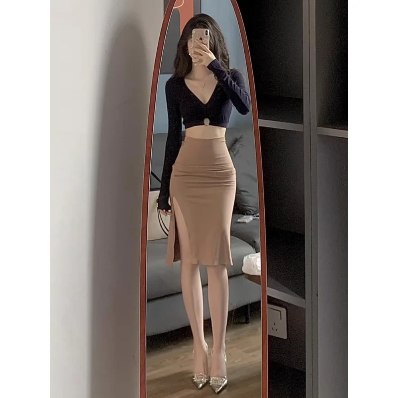 

Сексуальная утягивающая юбка-миди с высокой талией и разрезом, женская ранняя осень, новая модная модная модная повседневная юбка трапециевидной формы из полиэфирного волокна...