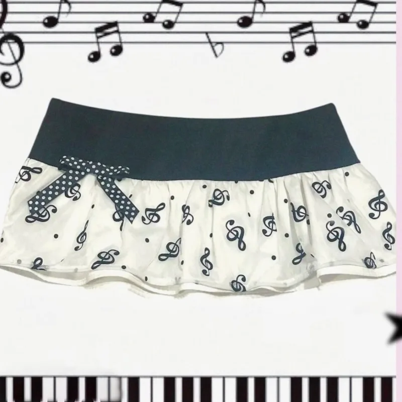 Y2K Music Note Print Mini Skirt, Black White Ruffle Micro Skirt with Polka Dot Bow,Kawaii Aesthetic Low Waist Skirt for Women