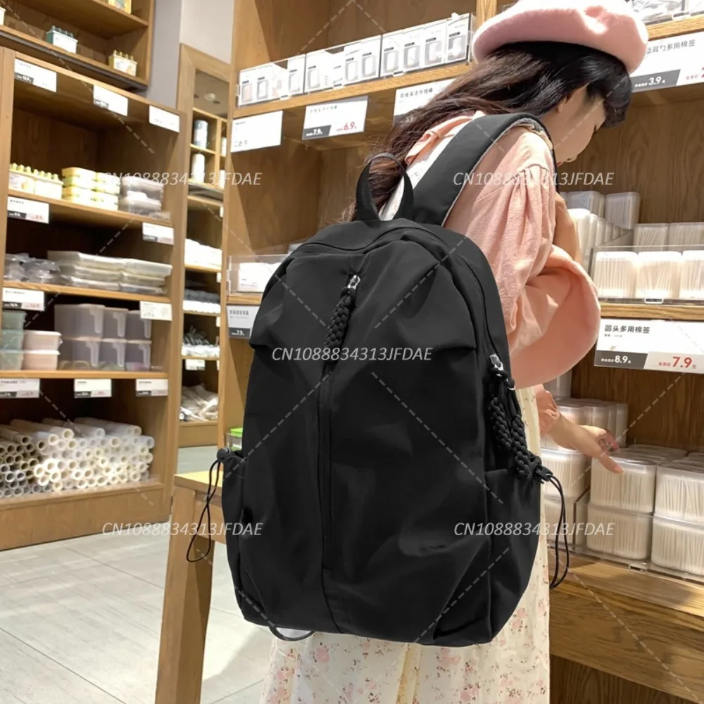 กระเป๋านักเรียนความจุขนาดใหญ่สําหรับผู้ชายและผู้หญิงกระเป๋าเป้สะพายหลังกีฬาลําลองกระเป๋าเป้สะพายหลังเดินทางสีทึบเรียบง่าย