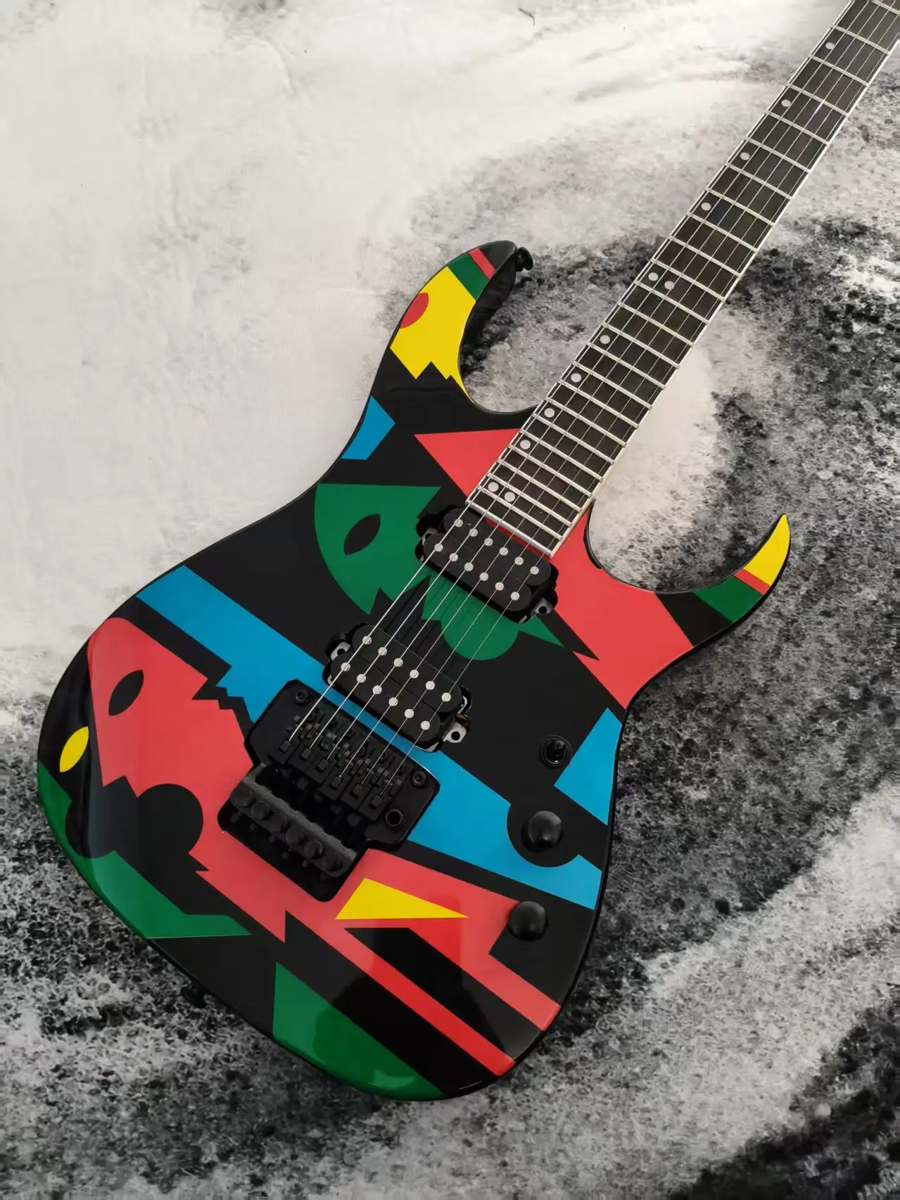 6 String Solid Body Electric Guitar, Bold Multi-Color Abstract Geometric Graphic Finish, Dual Humbucker Pickups