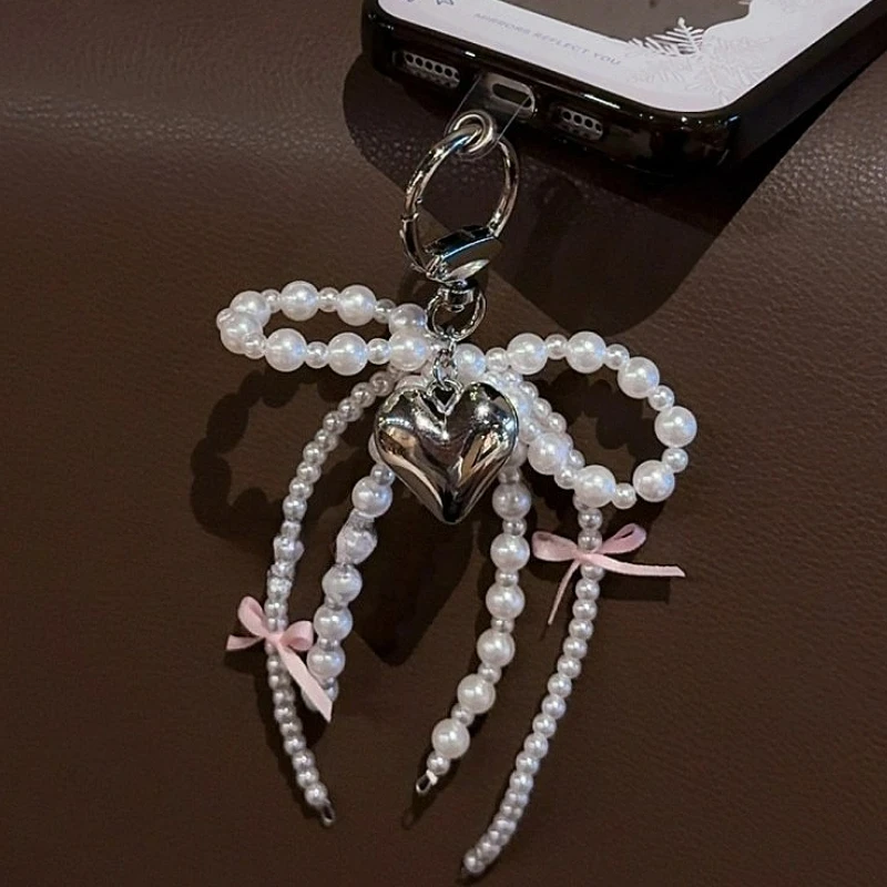 Y2K INS اللؤلؤ Bowknot المفاتيح النساء اللؤلؤ شرابات الوردي الشريط الحلو معلقة Keyrings ظهره حلقة رئيسية اليدوية مجوهرات هدايا