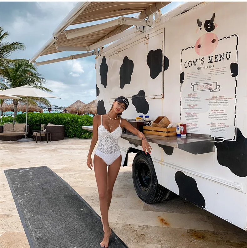 新しい韓国スリムワンピースレースセクシーな水着女性白背中の開いた鋼サポート温泉休暇水着