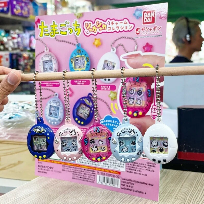 

Tamagotchi 1st Round Electronic Pet Rocking Music Pendant Twisted Egg Mamiji Anime Peripheral Toys Cute Decoration Popular Gifts