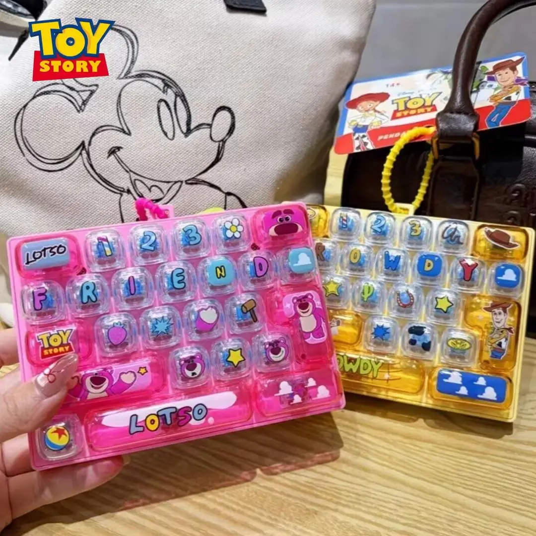 Meilleure vente : Porte-clés clavier 26 touches sur le thème de Toy Story, Woody Buzz, pendentif pour sac d'école, figurine d'anime, jouet anti-stress, cadeau