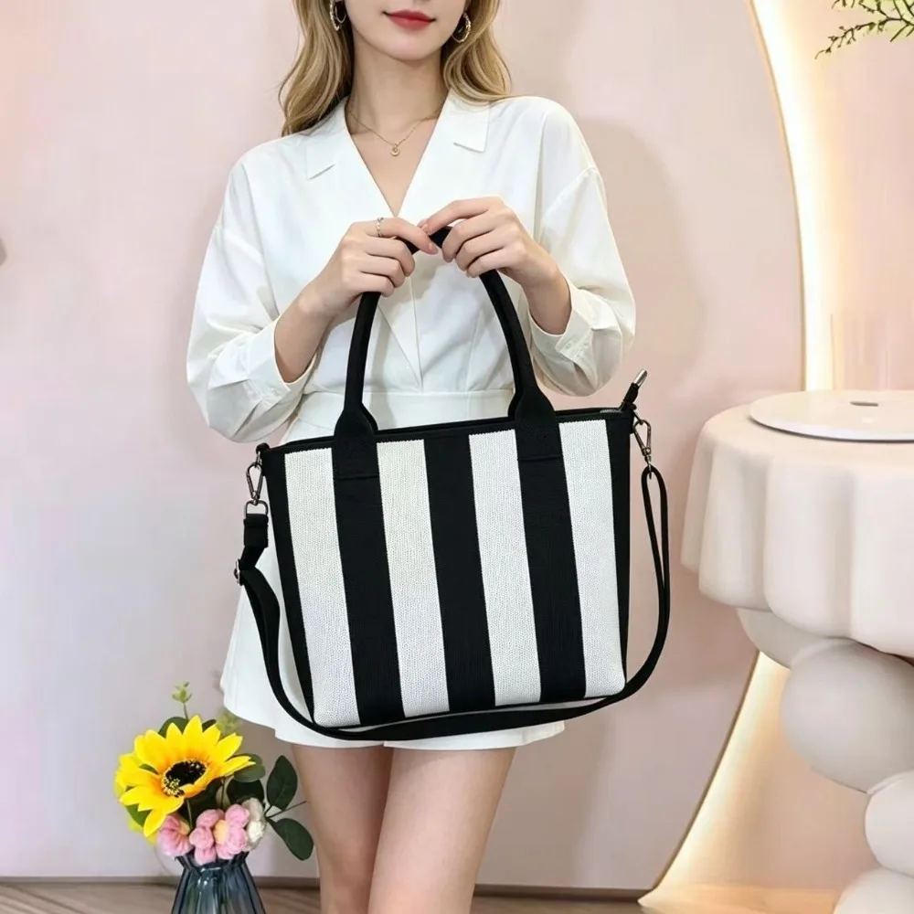 

New high-quality black and white striped leopard print fly-knit women's commuter zippered inner pocket fashion lightweight luxur