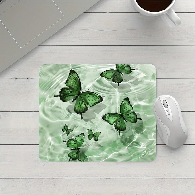 

The green butterfly design mouse pad, anti-slip rubber base, waterproof square PC desktop accessory is suitable for the office
