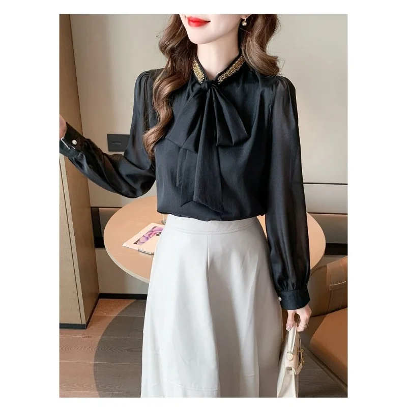 بلوفر نسائي جديد مخيط موديل 2025 بفيونكة موضة بلون سادة قمصان فضفاضة متعددة الاستخدامات غير رسمية بأكمام طويلة