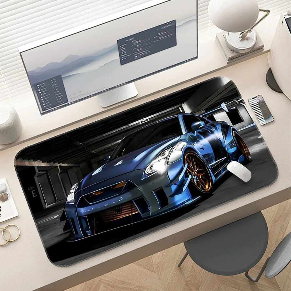 Blue racing table mat and game mat, with ergonomic design of sports car, and racing-themed workspace accessories tappetino mouse