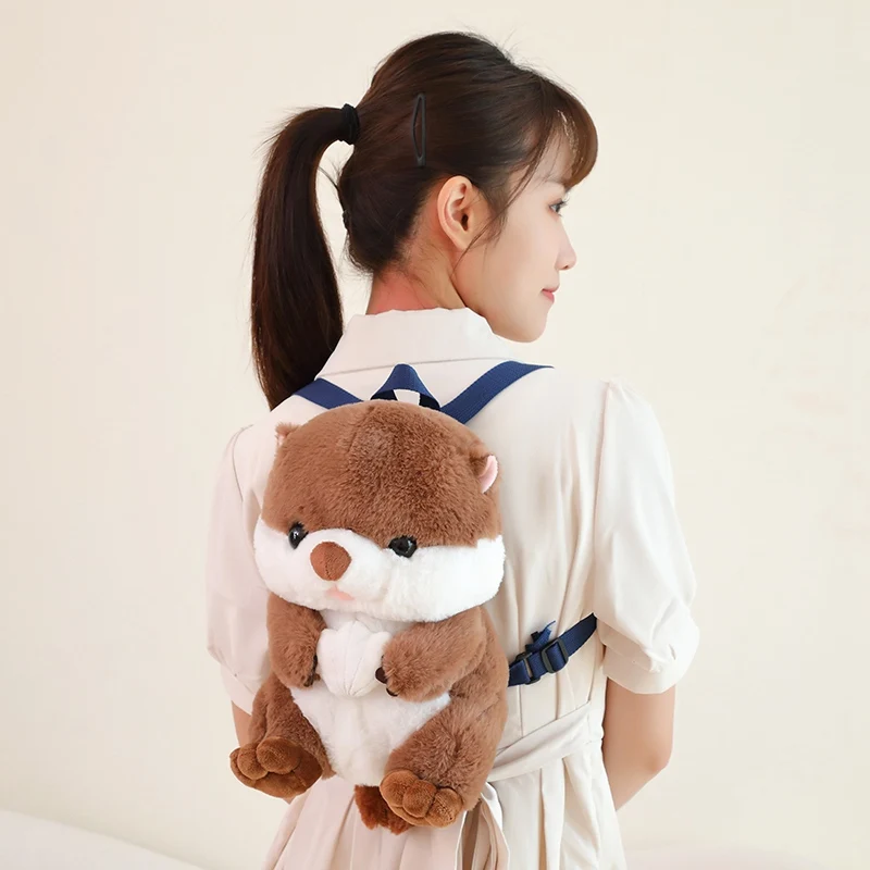 1Pc 28x18x18CM Lovely Otter Plush Backpack Dolls Cute Animal Otter Holding Shell Cartoon Backpack for Birthday Gifts