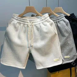 Pantaloncini da corsa estivi per uomo pantaloni corti sportivi da Jogging Casual modello a onde pantaloncini sportivi da palestra larghi con coulisse in tinta unita