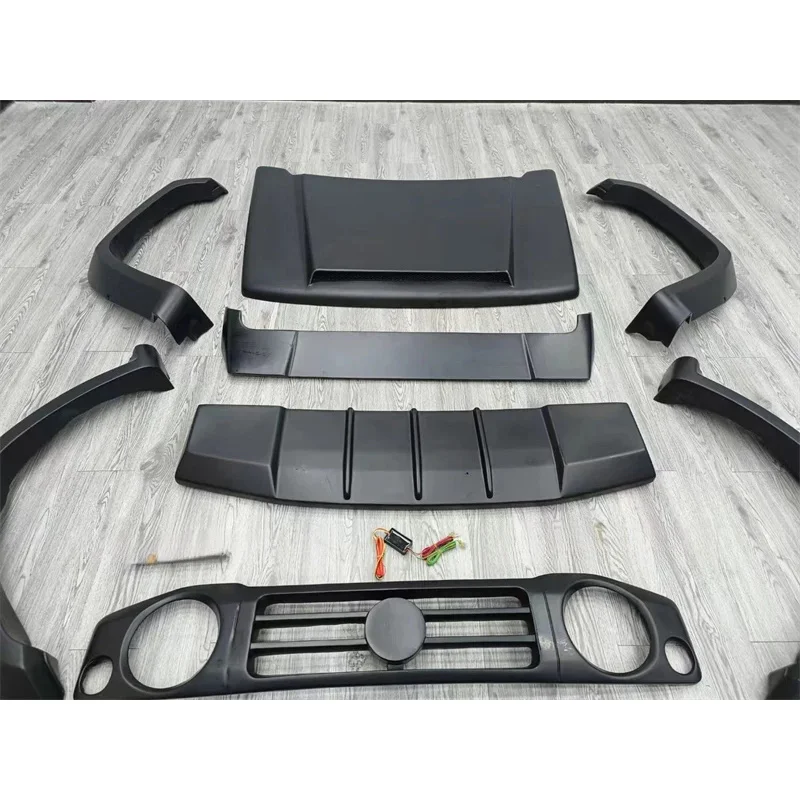 

Jim Body Kit: Resin-Primed Front and Rear Bumpers, Widebody Flares, and Rear Spoiler