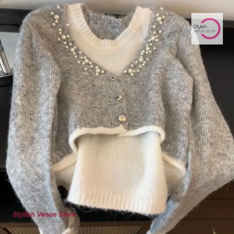 

Korean heavy industry beading stitching fake two-piece sweater women's autumn and winter lazy wind long-sleeved loose design top