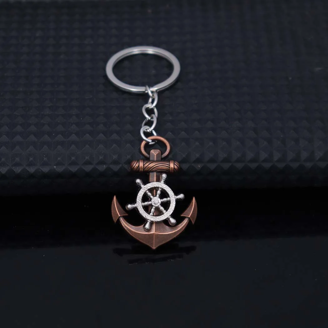 New style fashionable zinc alloy anchor and rudder pendant keychain hanger for men and women, creative bag accessory, car keycha