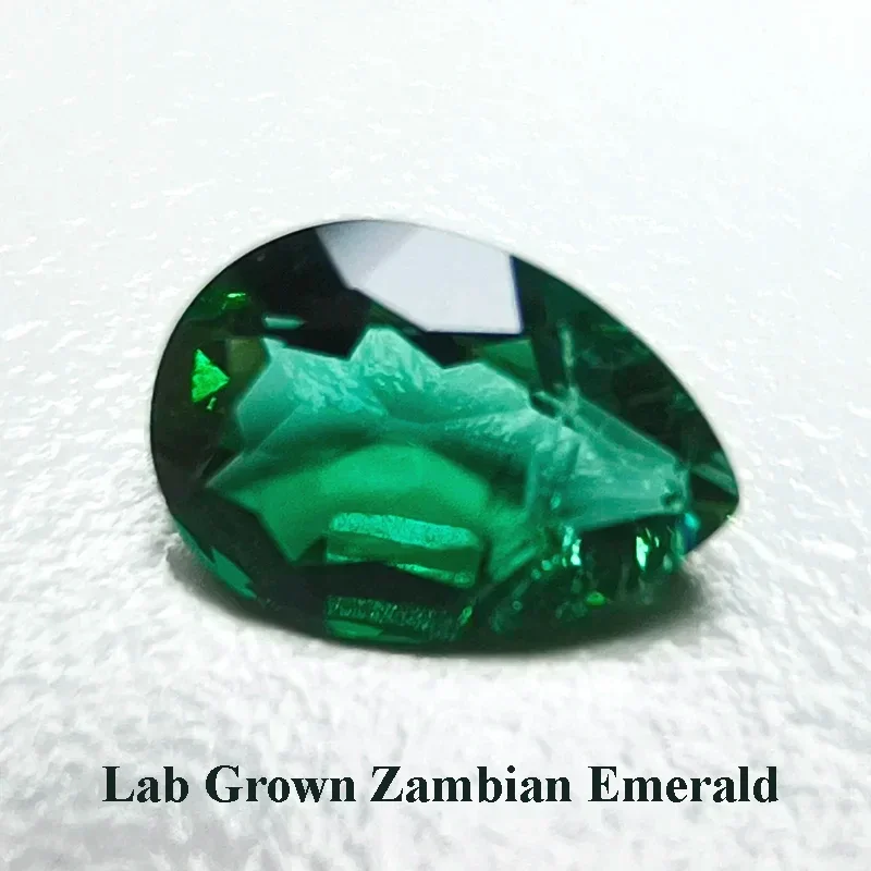 

Lab Grown Zambian Emerald Pear Shape Hydrothermal Hand Cutting Cut with Cracks Inclusions Inside Selectable AGL Certificate