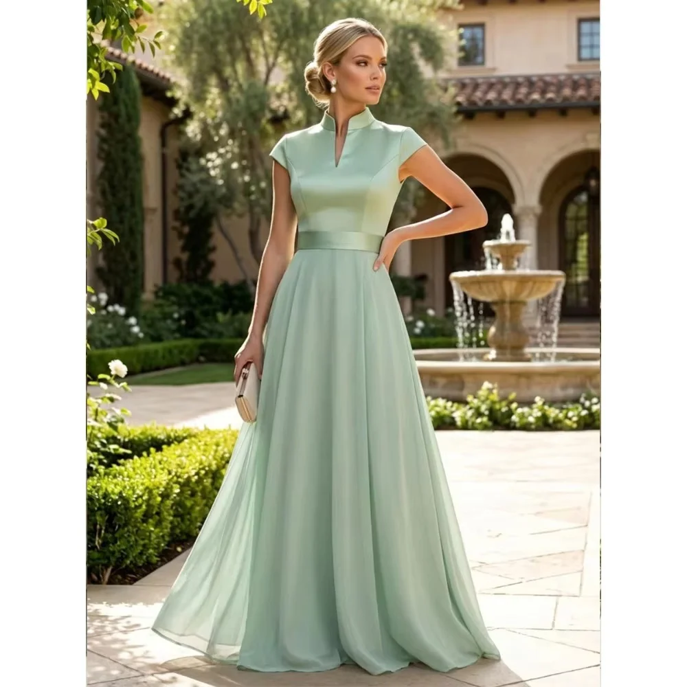 Elegant sage green high neck floor length gown with cap sleeves and waist sash. Soft flowy fabric, custom sizes available. Perfe