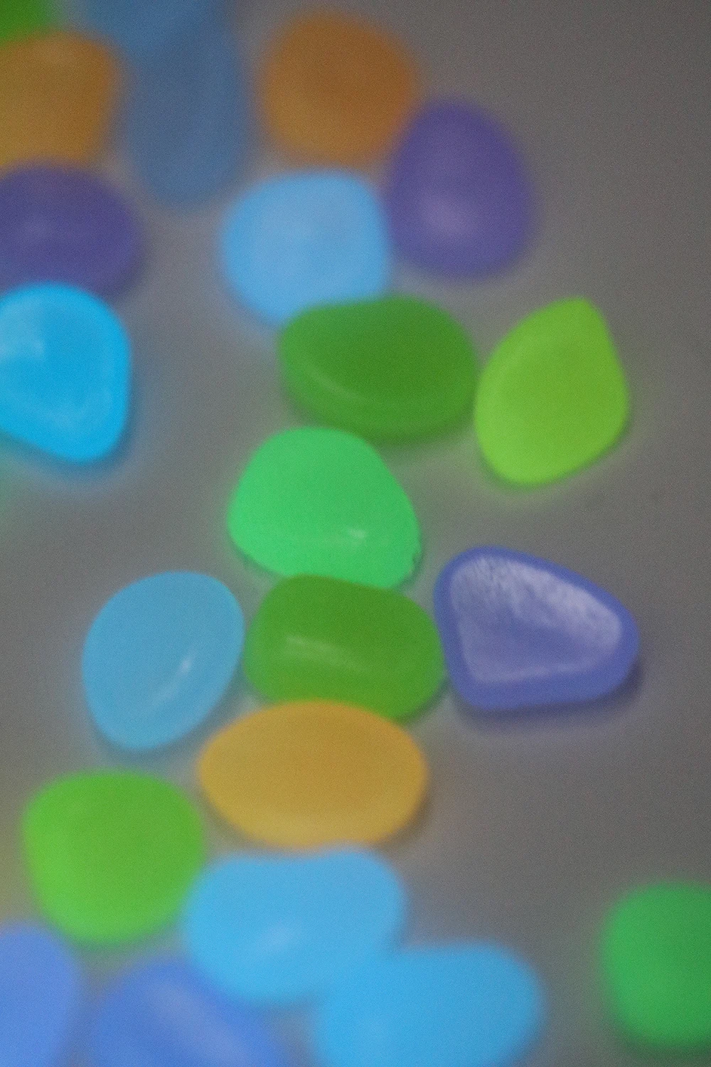 Boring a whole bunch of shiny little rocks! Glow-in-the-dark pebbles