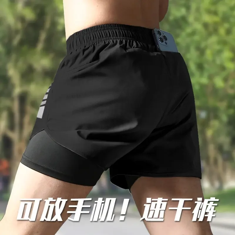 Pantalones cortos para correr para hombre, pantalones deportivos de entrenamiento de secado rápido de tres capas para verano, pantalones profesionales para maratón y fitness, con espacio para teléfono móvil.