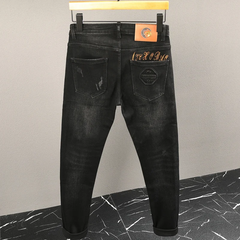 

Light luxury jeans with men's steel print and stylish embroidery design, elastic slim fit, small foot long pants