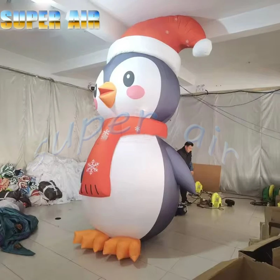 Pinguino natalizio gonfiabile gigante dal design speciale natalizio con cappello per la decorazione della festa