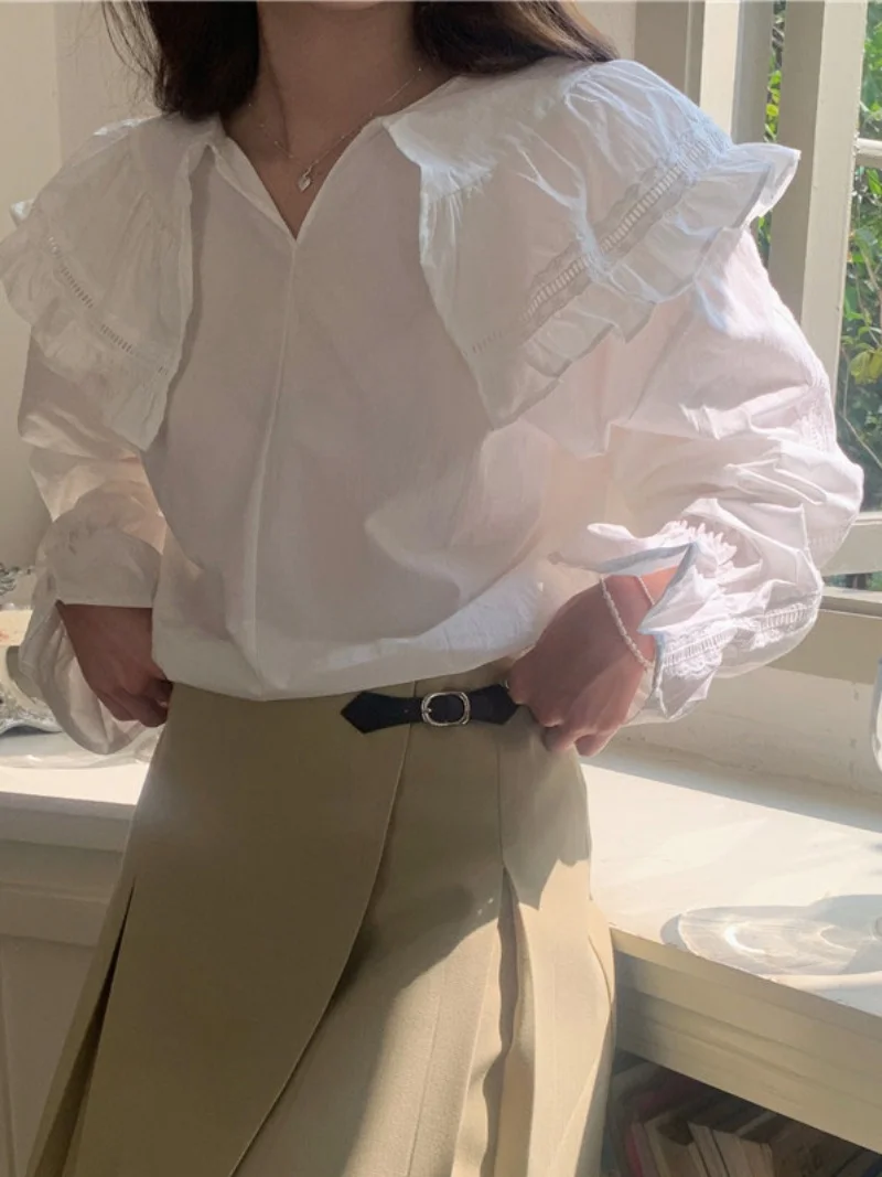 เสื้อแขนยาวทรงหลวมสไตล์เกาหลี คอระบายหวานๆ สำหรับผู้หญิง สีพื้น เหมาะกับฤดูใบไม้ผลิ ดีไซน์เก๋ไก๋ สไตล์ลำลอง แต่งผ้าต่อกัน
