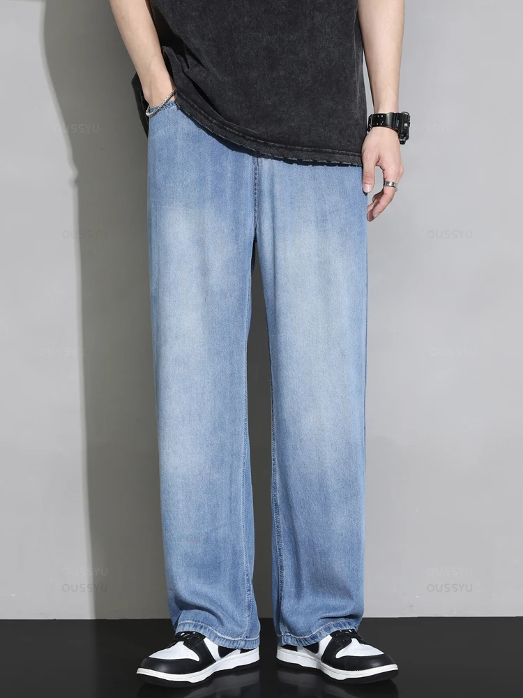 Letnie wysokiej jakości przytulne miękkie 100% Lyocell Jeans męskie spodnie dżinsowe z elastyczną talią Korea luźne, proste, niebieskie spodnie na
