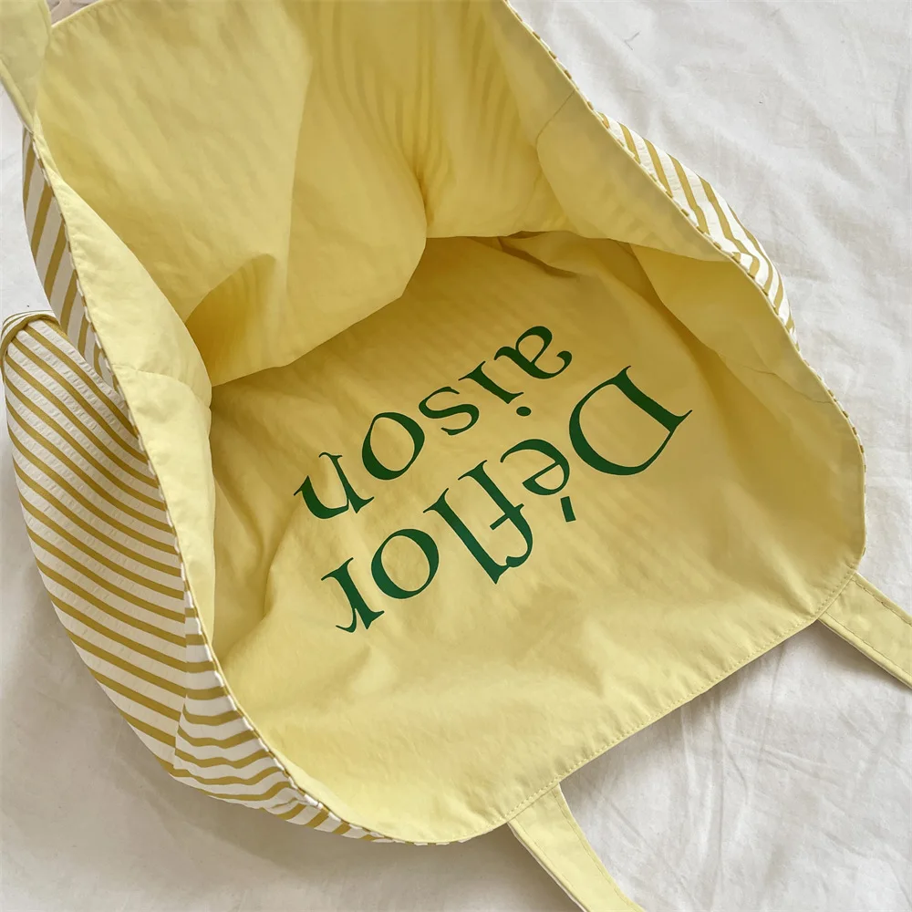 Sac fourre-tout double face Dopamine, trousse de maquillage pour rouge à lèvres, sac de voyage décontracté à bandoulière simple, sac de rangement pour lettres colorées rayées