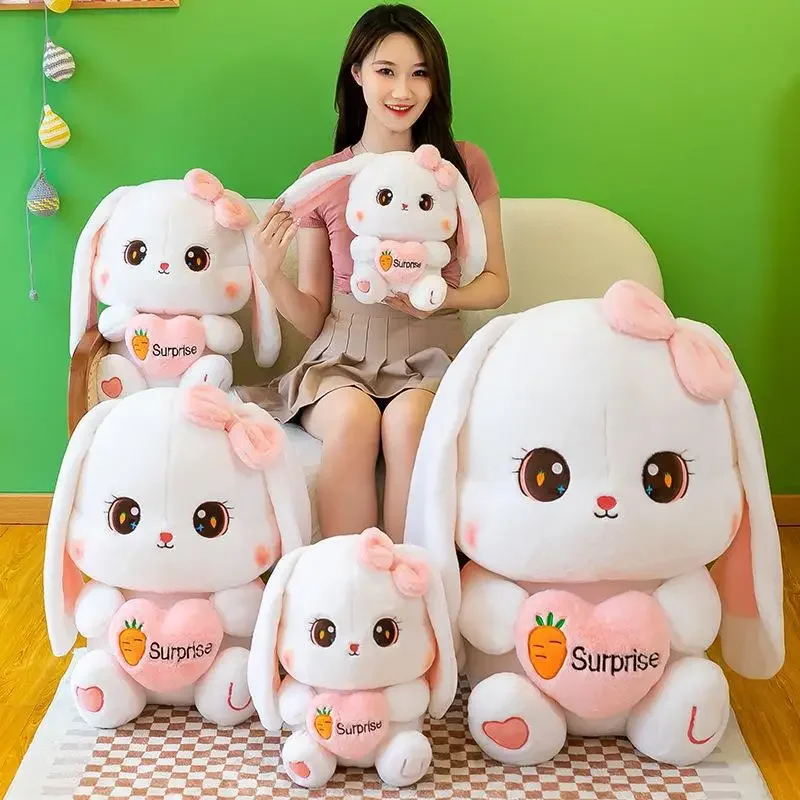 Simpatico coniglietto di peluche Kawaii, coniglietto di peluche che tiene una bambola con orecchie a cuore, regalo di compleanno per fabbrica di coppie di ragazzi e ragazze