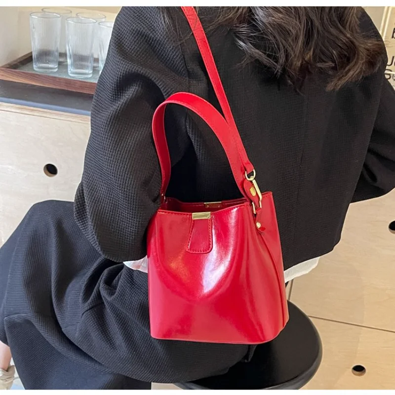 

Women's Black Glossy Leather Bucket Bag with Top Lock, for Daily Office, Streetwear, Weekend Travel, Shopping & Errands Handbags
