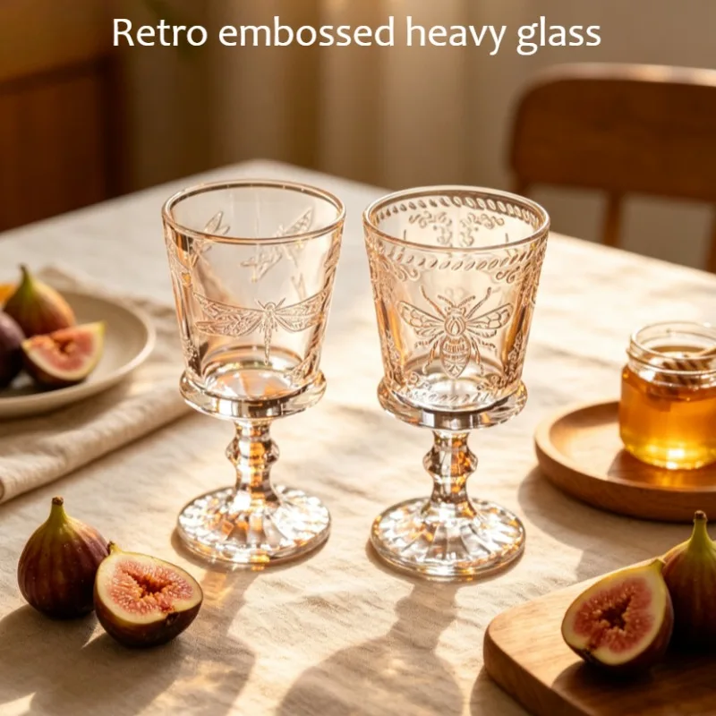 Butterfly relief transparent glass cups, retro and antique drink cups, coffee cups and tall red wine glasses.