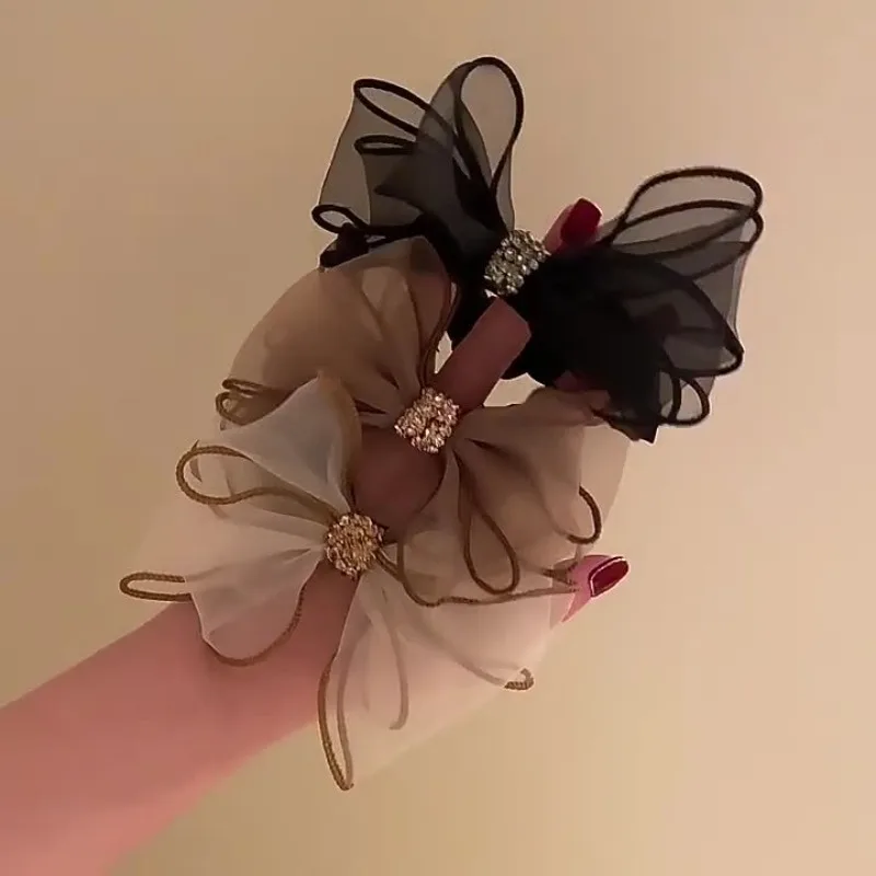 

Mesh bow, rhinestone, large intestine hair band, Korean temperament, girl tie ball head, rubber band, headrope.