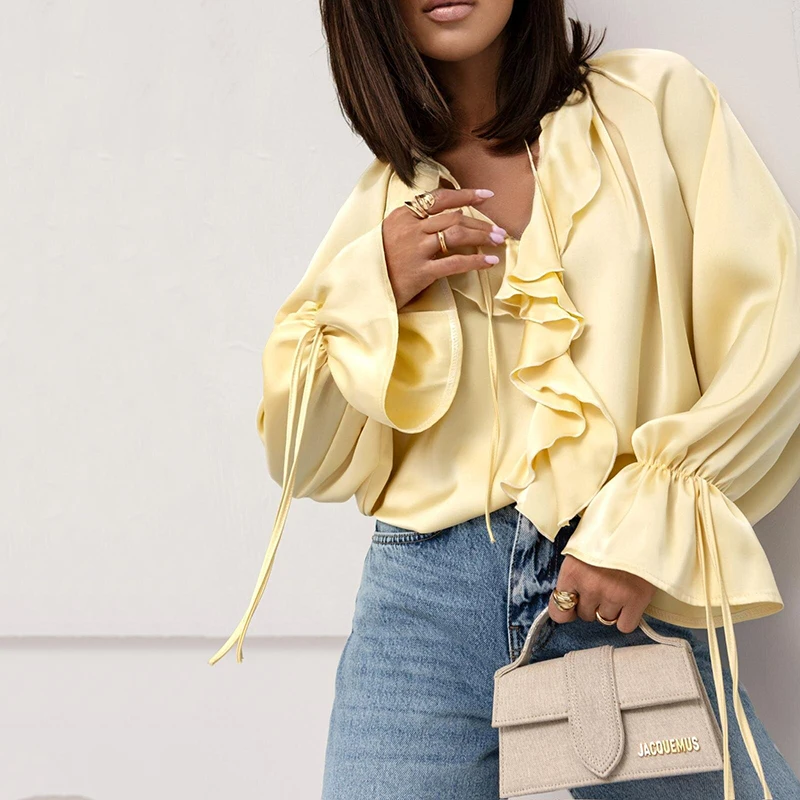 ฤดูใบไม้ผลิฤดูร้อนแฟชั่นเสื้อหลวมสําหรับผู้หญิงสบายๆสีทึบ O คอ Lace Up Flared แขน Splicing Ruffle เสื้อ