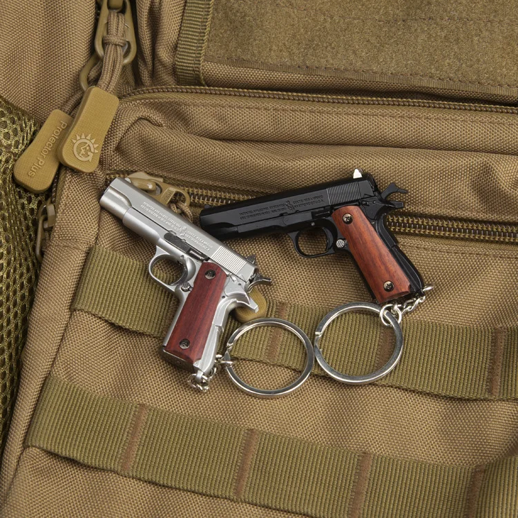 Mini Gun Toys 1/3 Metal 1911 Keychain Shell Eject Wood Grip Toy Gun Miniature Collection of Alloy Pistols Pendant for Gift